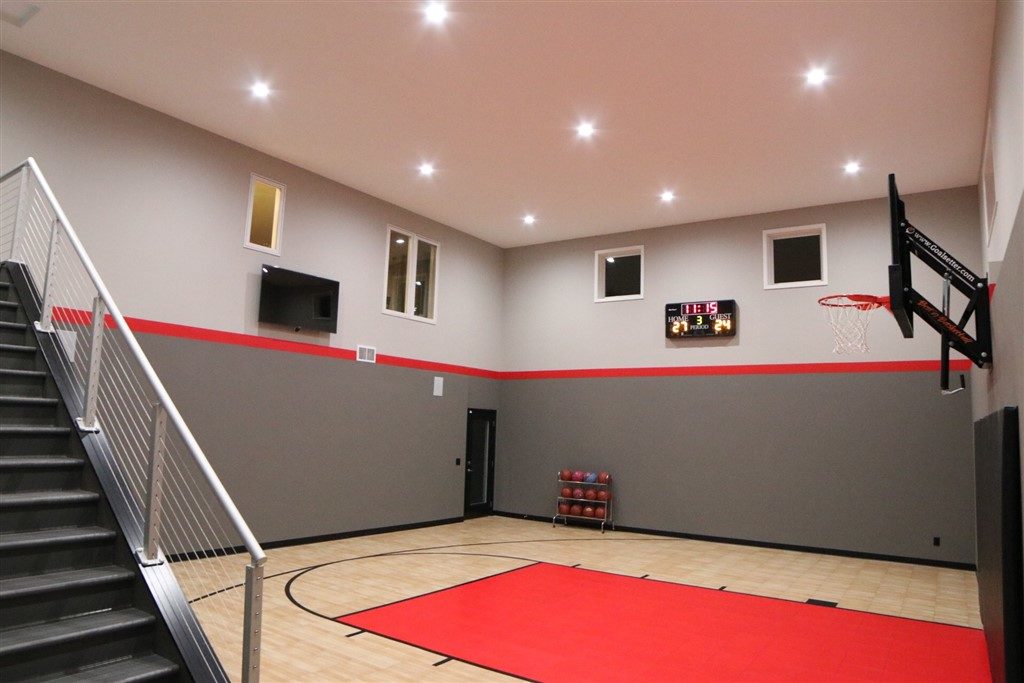 Eden Prairie_Indoor Basketball Court Featuring SnapSports Revolution Tuffshield Light Maple and Red athletic flooring tiles