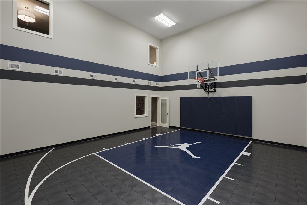 Millz House custom basketball court utilizing SnapSports athletic tile flooring