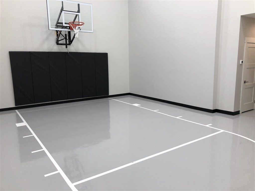 Twin Cities Spring Parade of Homes #33 indoor basketball court with epoxy floor coating installed by Millz House