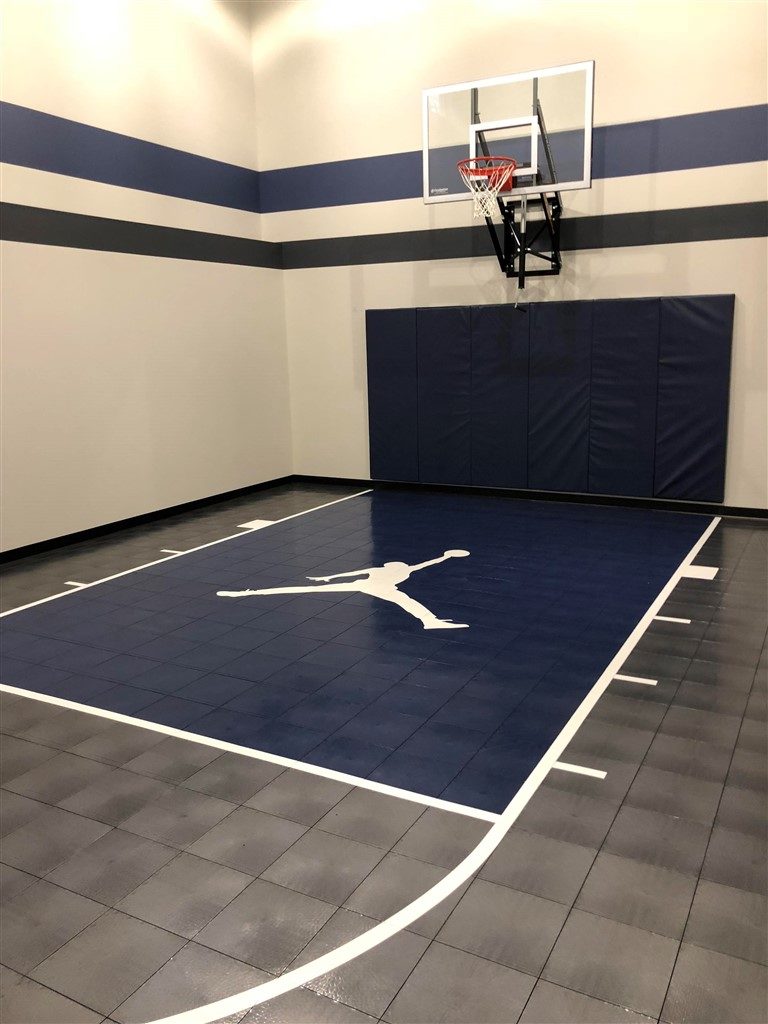 Twin Cities Spring Parade of Homes #36 indoor basketball court with SnapSports athletic tile flooring installed by Millz House