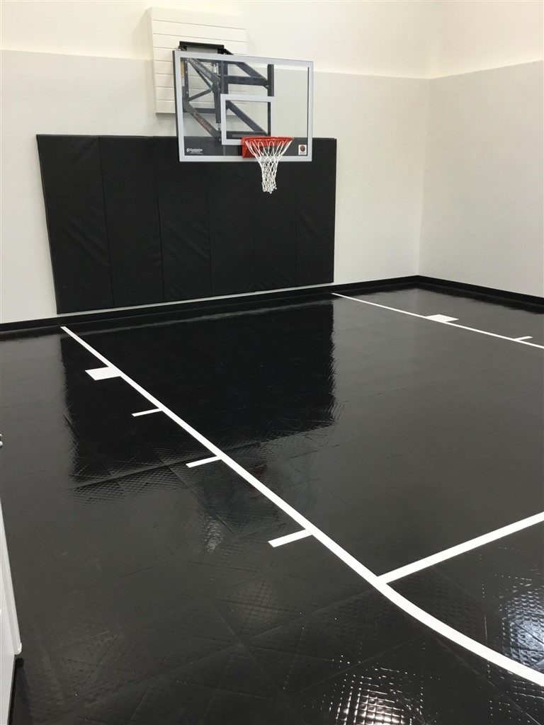 Twin Cities Spring Parade of Homes Indoor Basketball Court installed by Millz House featuring SnapSports Revolution athletic flooring
